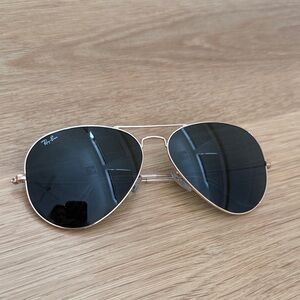 Ray-Ban Aviator Sunglasses with Black Lenses and Gold Frame